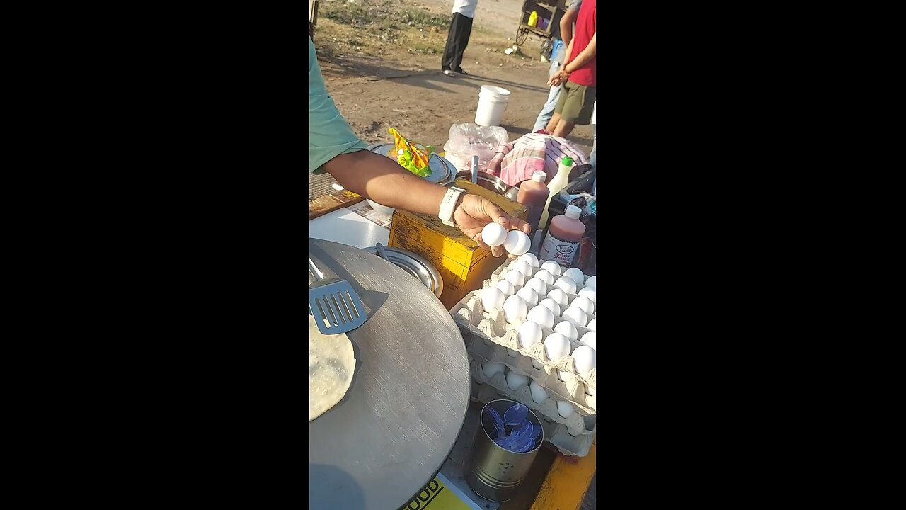 A boy making omlet pratha