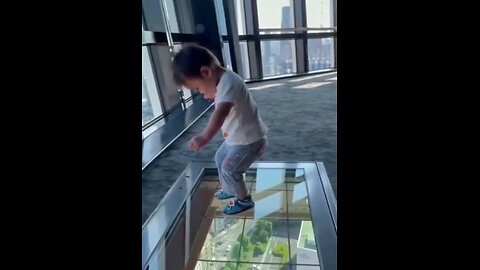 Baby walking on glass floor