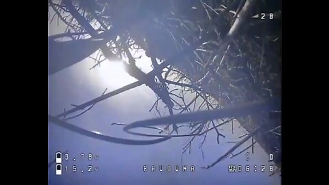 A Russian soldier hits a crashed drone with a stick subscribe