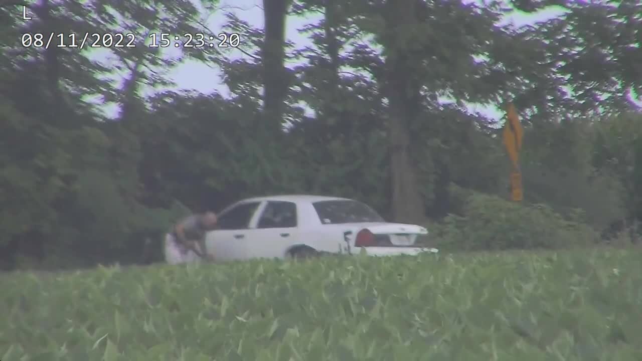 RAW: Video shows man who tried to break into FBI office in Cincinnati hiding behind car in standoff