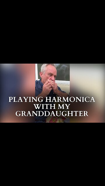 Playing Harmonica With My Granddaughter