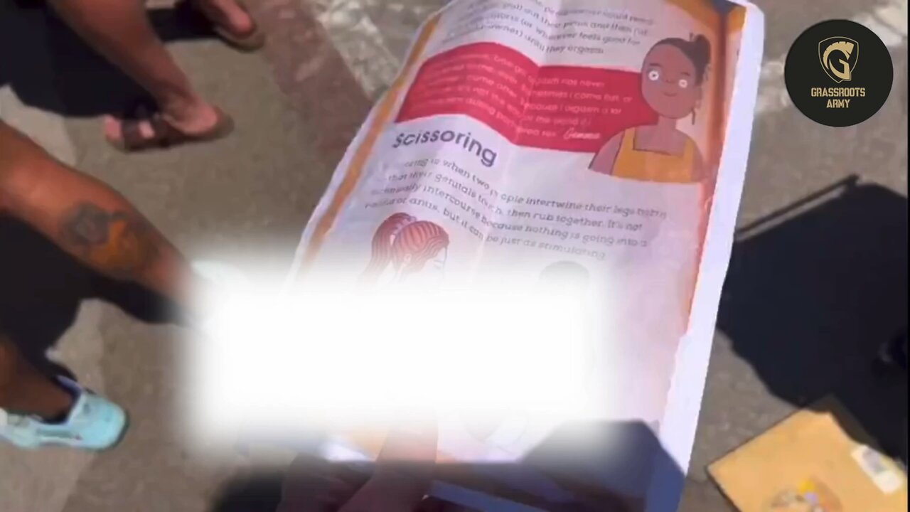 Guy Shows Pride Supporters An Explicit Book That Is In School Library. They Give Him The Finger