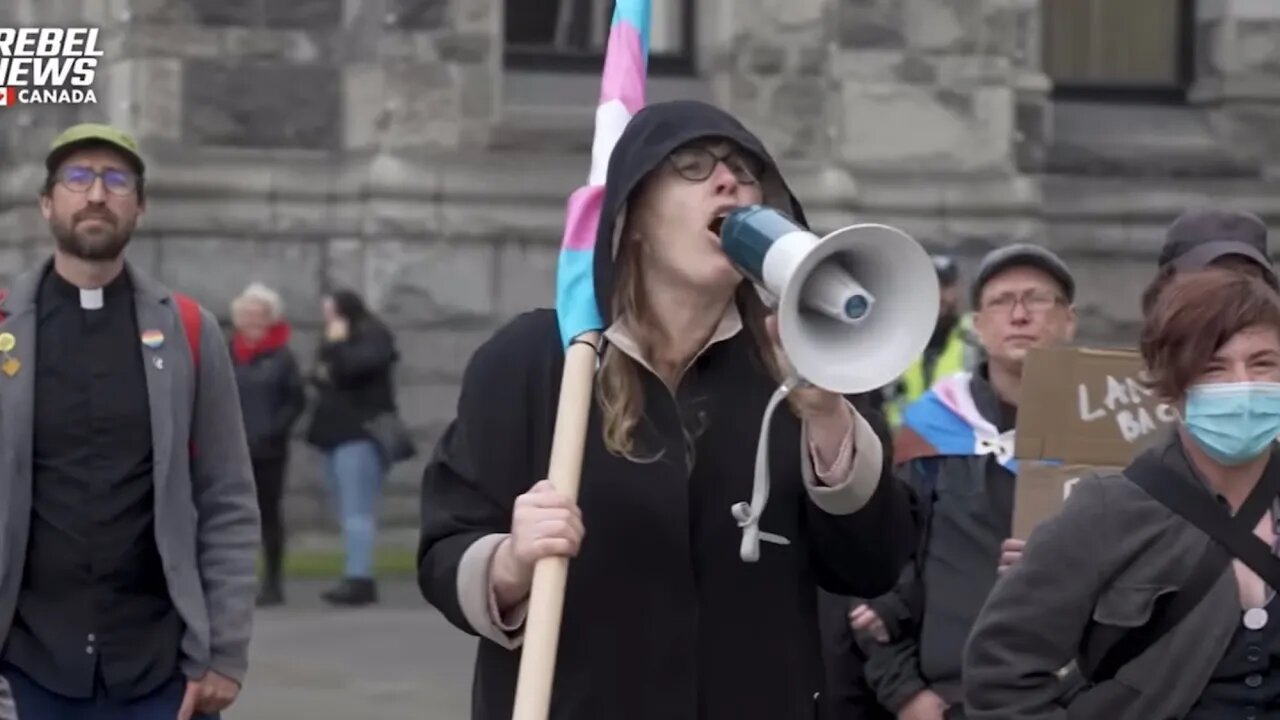 Trans Activist Throws Bucket of Water on Freedom Protestors