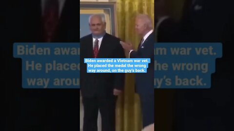 Biden places medal backwards while awarding Vietnam vet