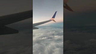 Clouds under the airplane during sunset time, taken on a plane from Cancun to SFO. #shorts