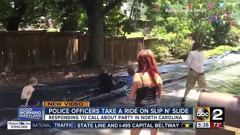 NC police officers take ride on slip 'N slide