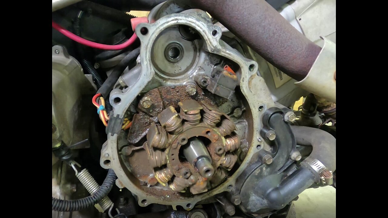 2002 Polaris Sportsman 700- Part 3 - fixing stripped threads and cleaning up the flywheel & stator.