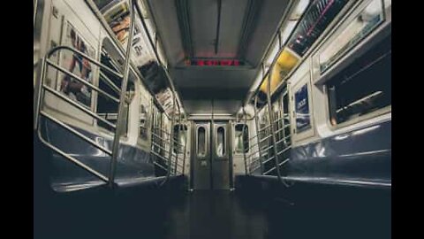 Man wildly spinning around on the subway