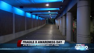 Fourth Avenue underpass lit up teal for awareness of Fragile X