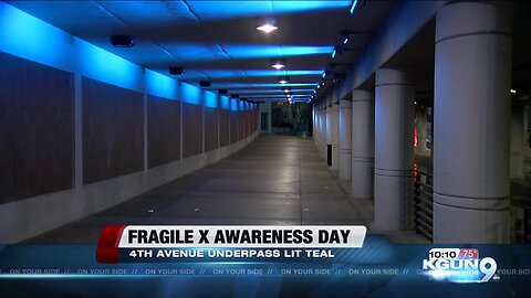 Fourth Avenue underpass lit up teal for awareness of Fragile X