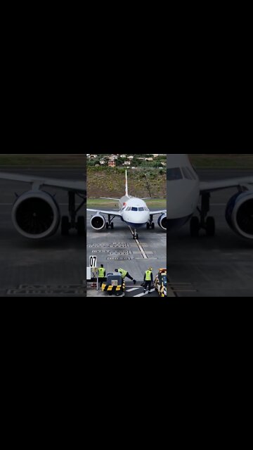 Guiding the British Airways plane onto its stand at Funchal Airport, Madeira