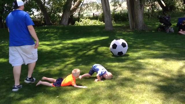 Baby Boy Gets Knocked Over By A Giant Ball