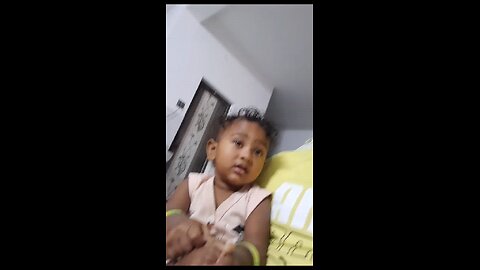cute indian baby trying hard not to sleep
