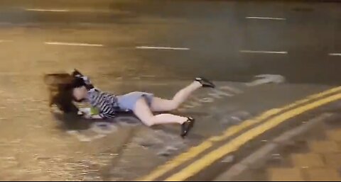 GRAPHIC: Typhoon Saola SLAMS Woman into the Ground with Powerful Winds