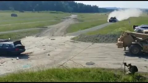 Tank drives *through* a car at full speed