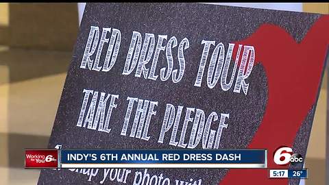 Women and men in red made their way around Monument Circle to raise awareness about women's heart health