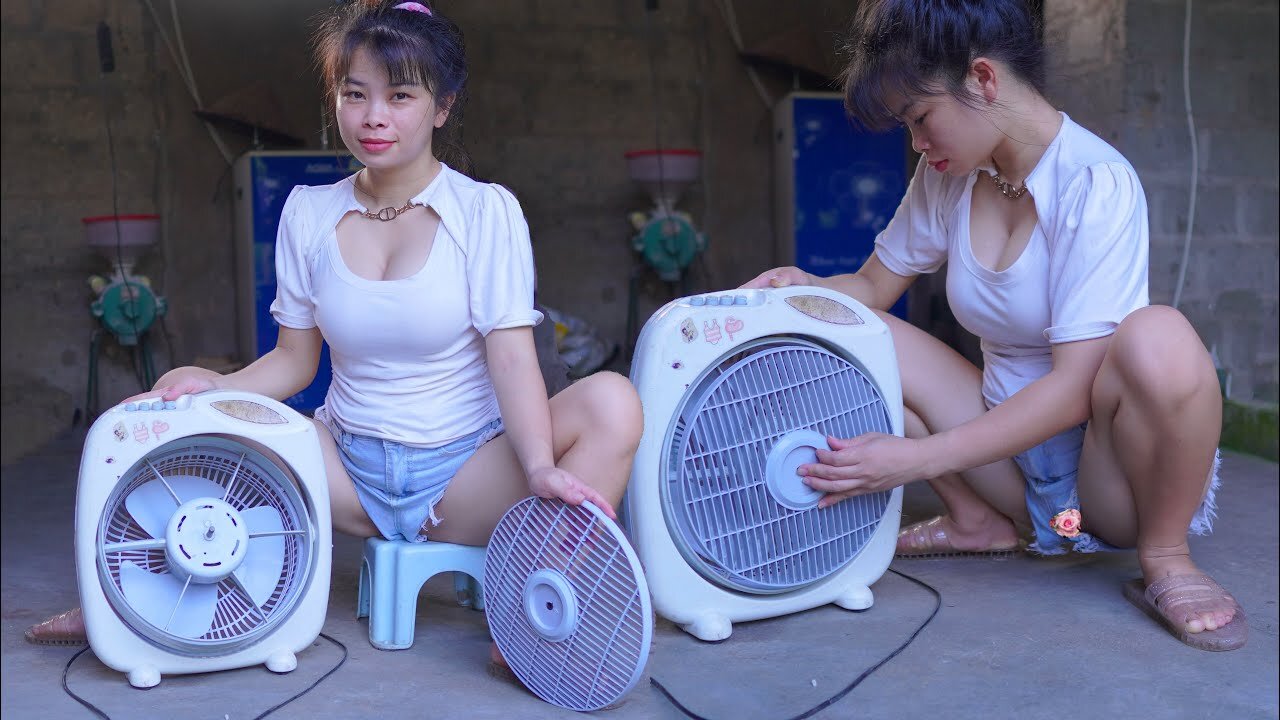 female mechanic repairs and restores broken electric fans