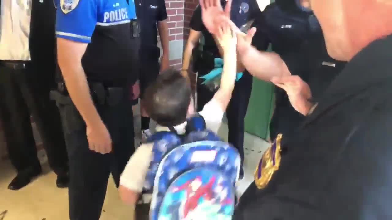 West Palm Beach police escort fallen officer's son to kindergarten