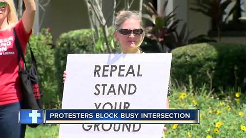 Protesters block intersection