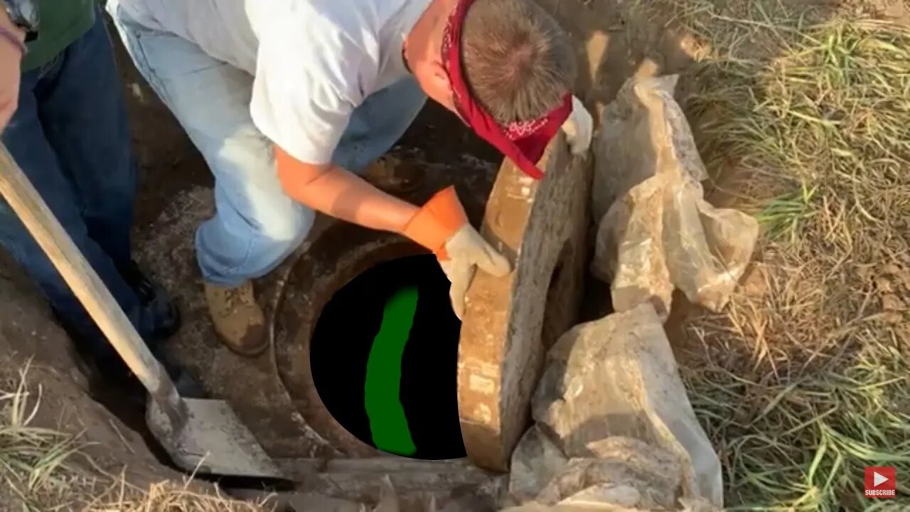 Mysterious Manhole, Buried Two Feet Underground?