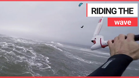 Brave kitesurfers take to the water during Storm Callum