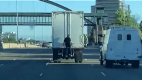 Guy hitches lift on back of truck