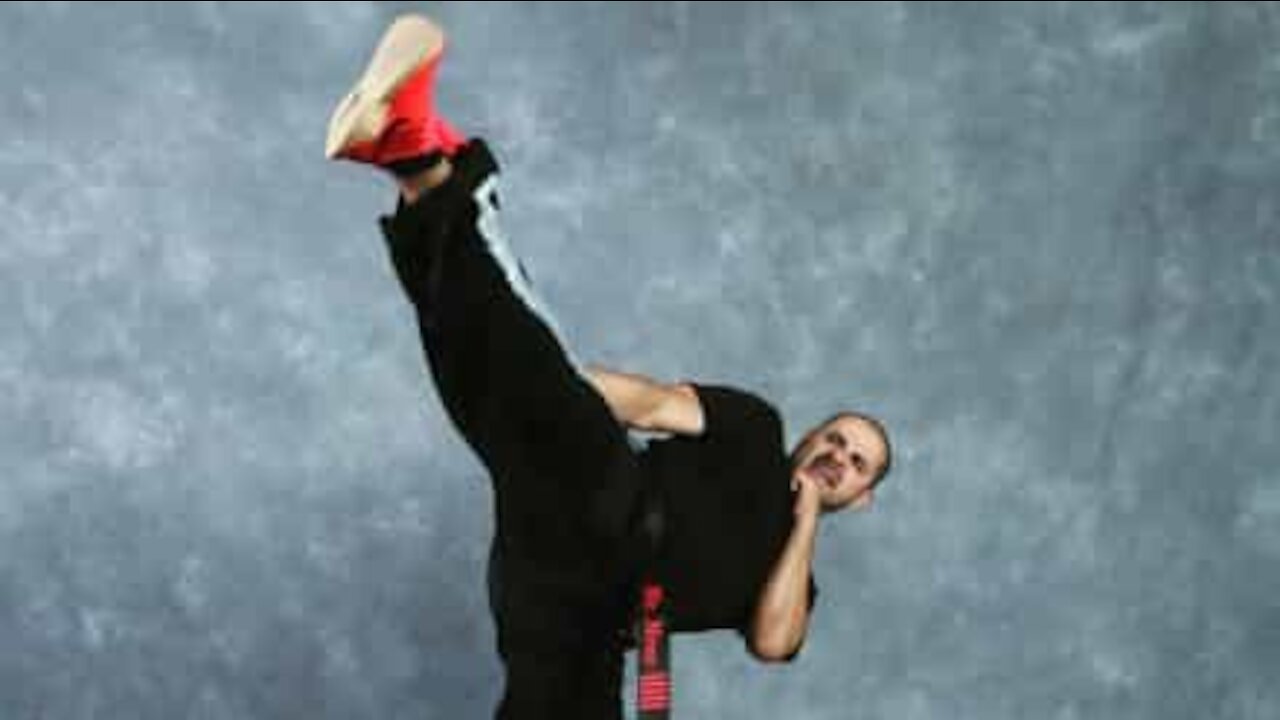 Guy demonstrates martial arts skills using toilet paper