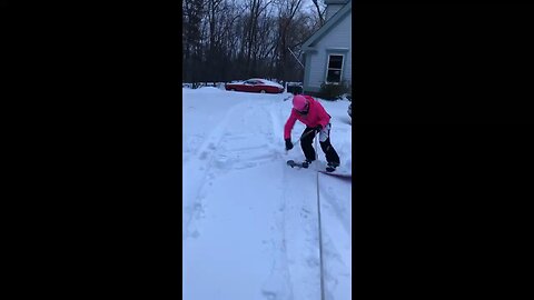 My daughter doing an imitation of a redneck snowboarder