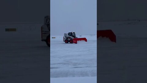 Bobcat snowplowing