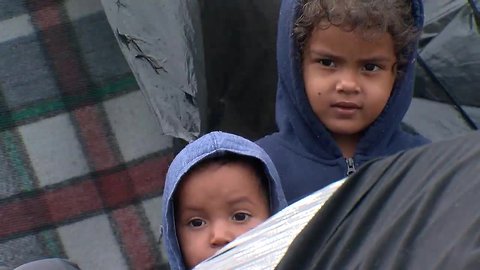 Migrants wait in Mexico as second round of rain moves in
