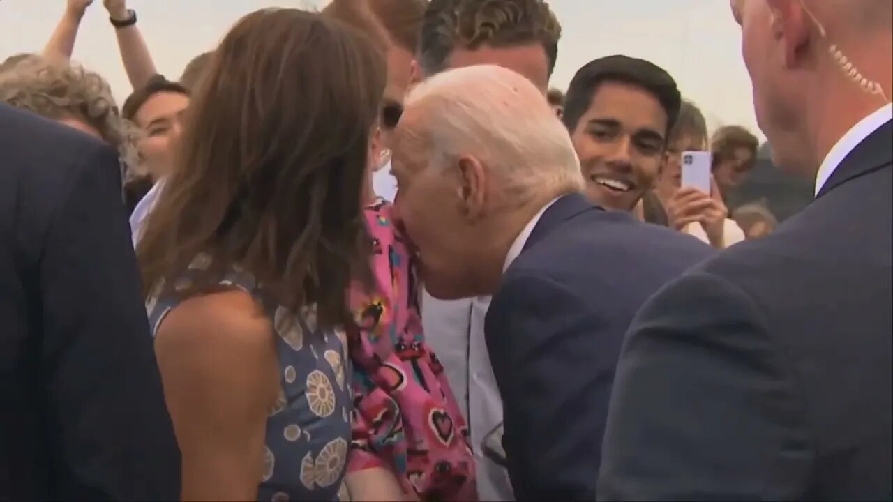 Joe Biden "Nibbles" on Young Child