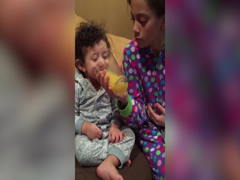 Toddler Loves to Laugh about Orange Juice