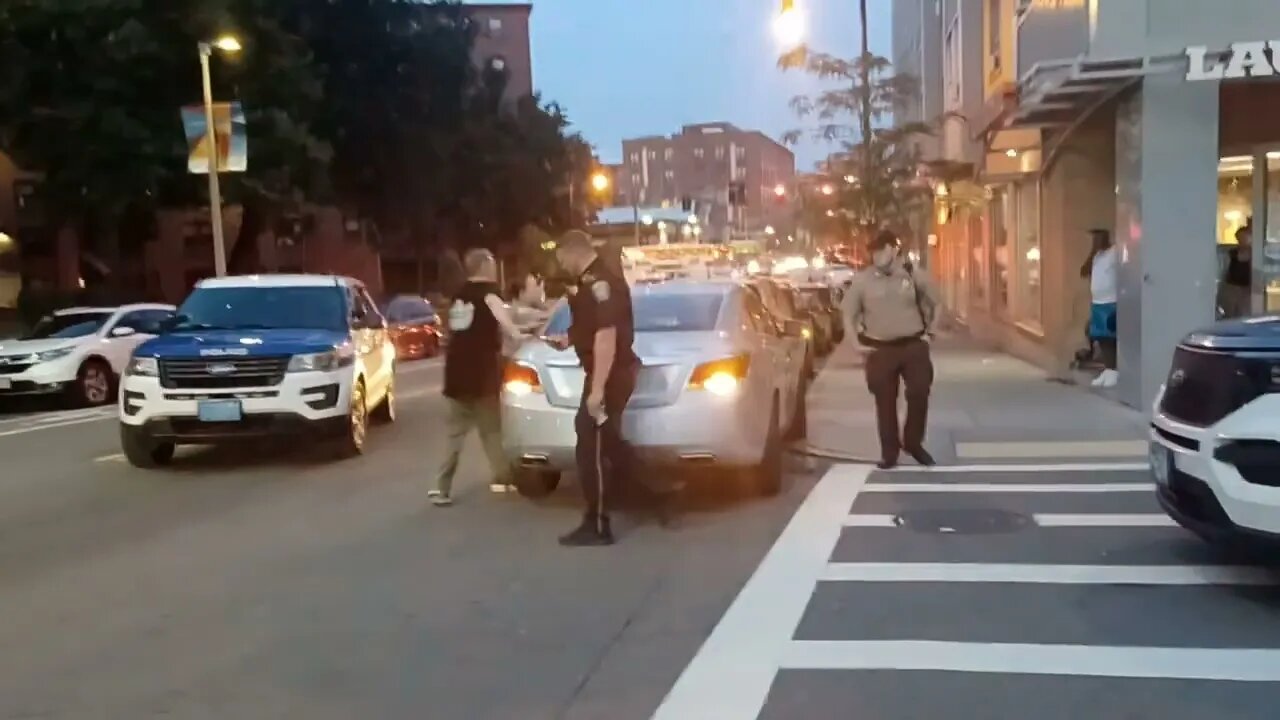 Boston police respond to a car that ran into a building on Center Street