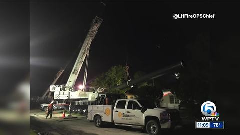 Last piece of toppled crane moved from home