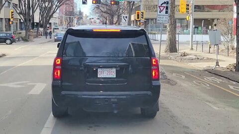 Suburban Full of Cops, "unmarked", keeping Lawrr & Orderr @ EDMONTON FREEDOM RALLY FEB 12, 2022