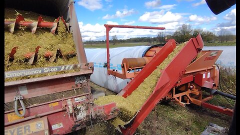 Filling silage bag with corn silage