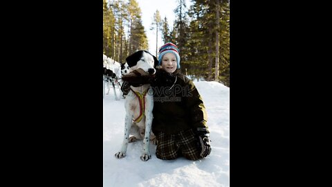 A child petting his dog