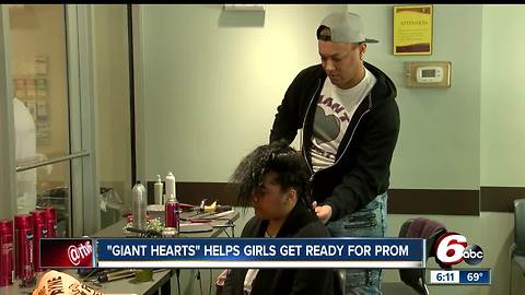 Giant Hearts volunteers help students from Ben Davis High School get ready for prom