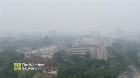 A think haze sits over Winnipeg as wildfire smoke pushes across the province