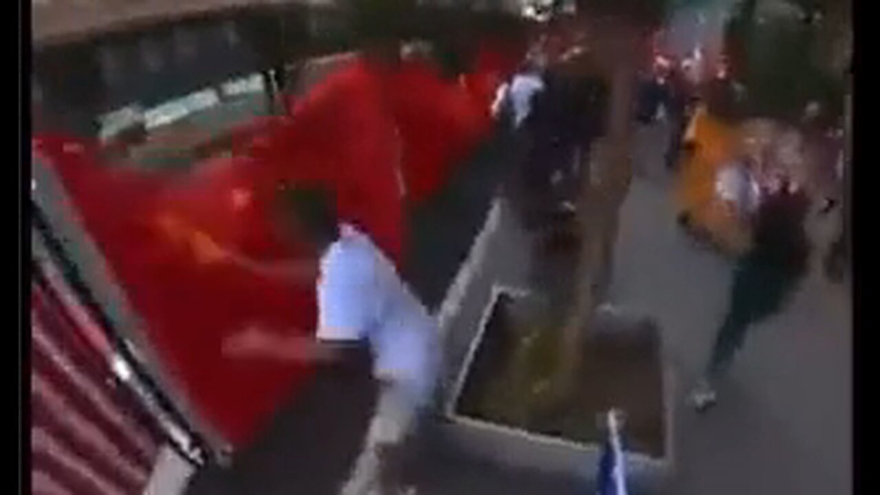 Chinese flags being torn down in San Francisco by angry protesters