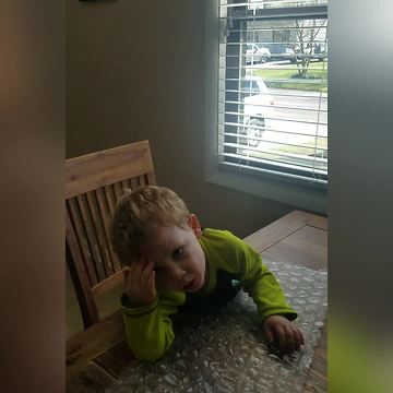Funny Boy Headbutts Bubble Wrap To Pop It