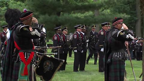 The playing of "Taps" at Lt. Aaron Allan's burial