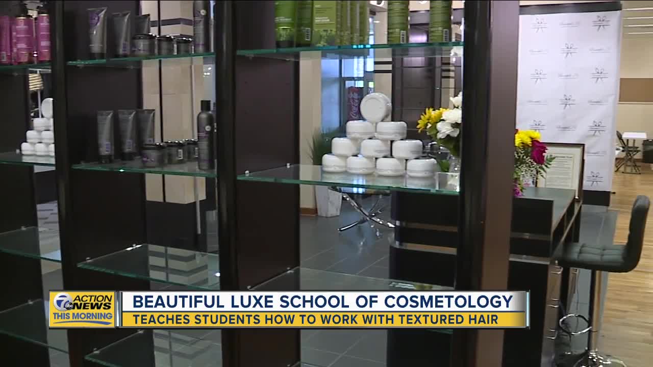 Woman teaches students how to work with textured hair