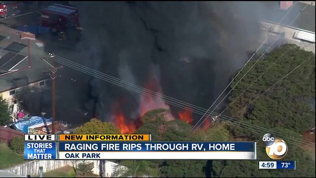 Raging fire rips through RV, home