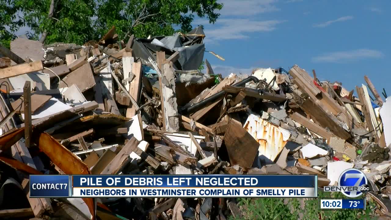 Burdened by fire-gutted eyesore for 10 months, Westbury tenants now coping with moldy debris pile