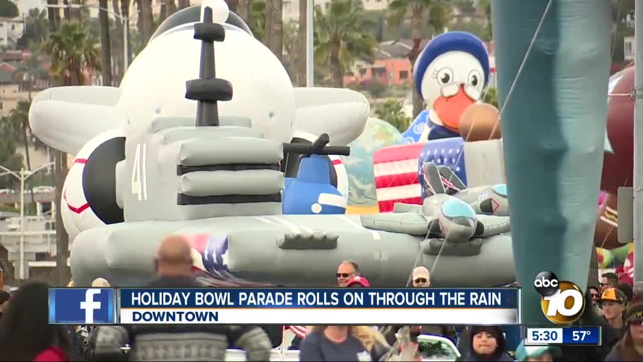 Holiday Bowl Parade rolls on through the rain