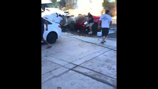 Videos show neighbors trying to extinguish car fire