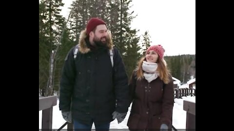 Beautiful couple in nature - A Winter Landscape And Couple Crossing The Bridge