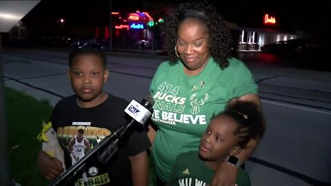 Fans greet victorious Bucks as they arrive back in Milwaukee