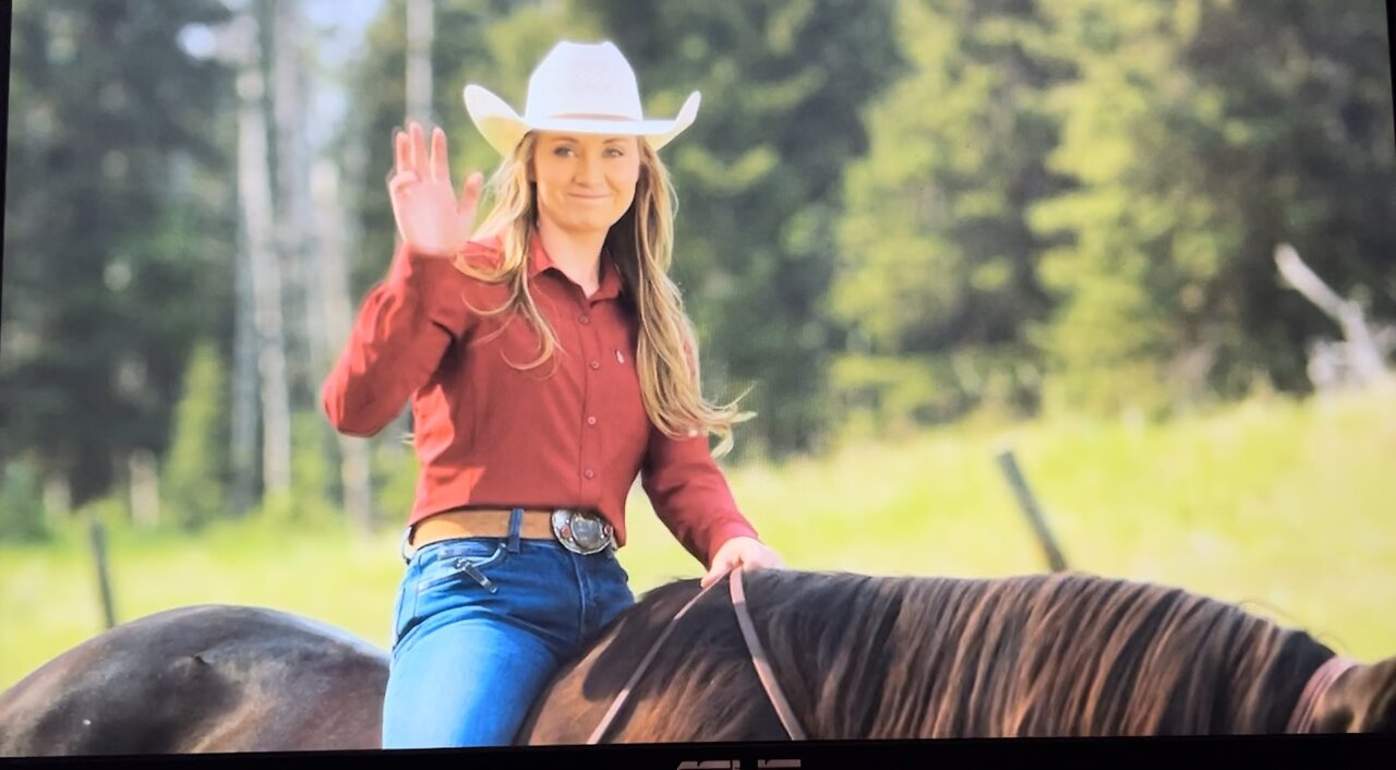 Heartland 17X03 Amy waves to Nathan Pryce Jr. in the field